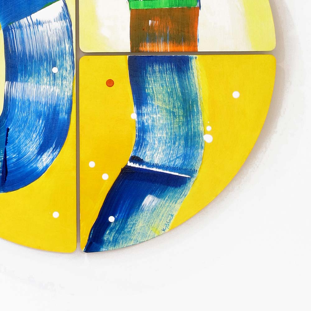 Detail of Hippo Water Chute wall sculpture by Kirsty Black showing bold cobalt blue looping forms with fine linear detailing across a vivid yellow ground, with green, orange and red accents at the tile junction.