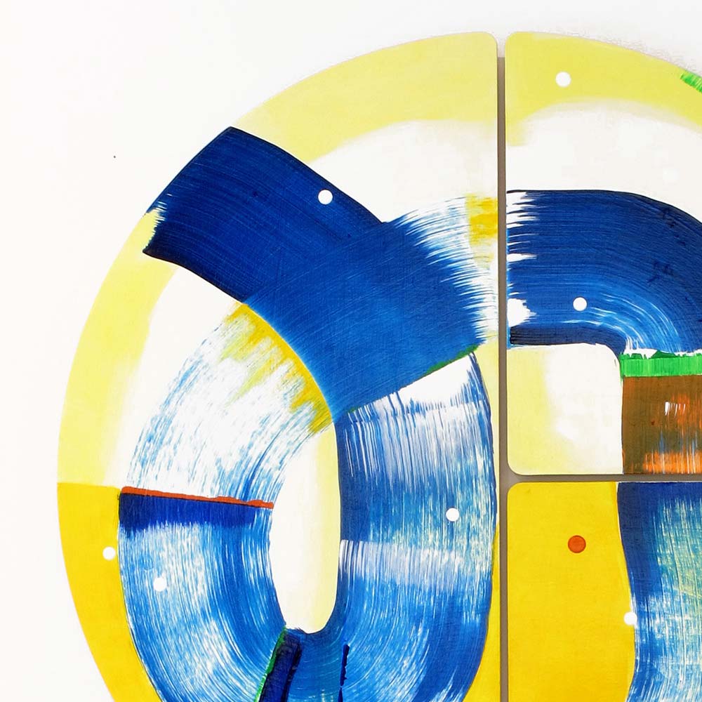 Detail of Hippo Water Chute wall sculpture by Kirsty Black showing a broad cerulean blue brushstroke curving across vivid yellow with white dot accents, orange and green colour blocks visible at the panel join.