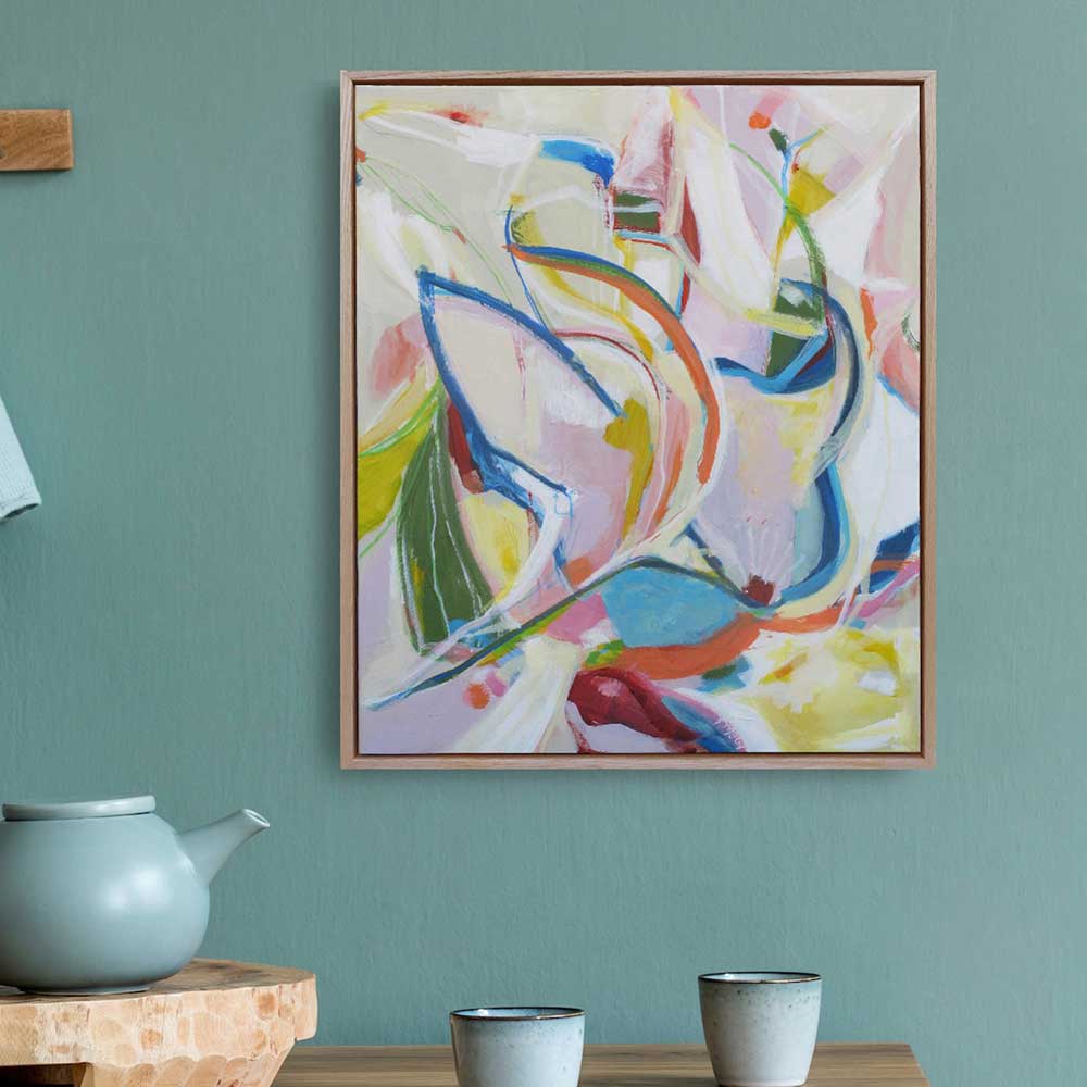 Budgie Bustle abstract painting by Kirsty Black in natural cedar frame hung on teal wall above wooden shelf with teapot and cups
