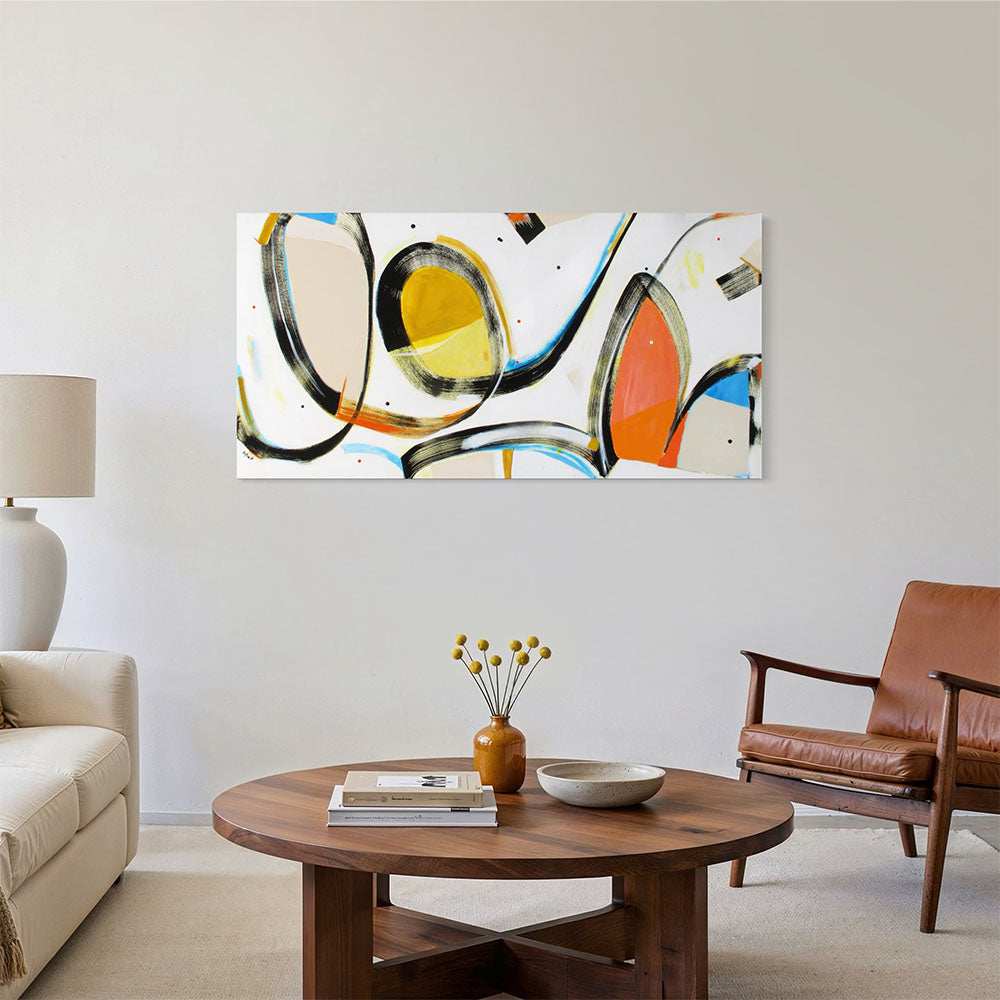 Catapult Katarina abstract painting by Kirsty Black hung on white wall in bright contemporary living room with tan leather armchair, round timber coffee table, ceramic vase and cream sofa