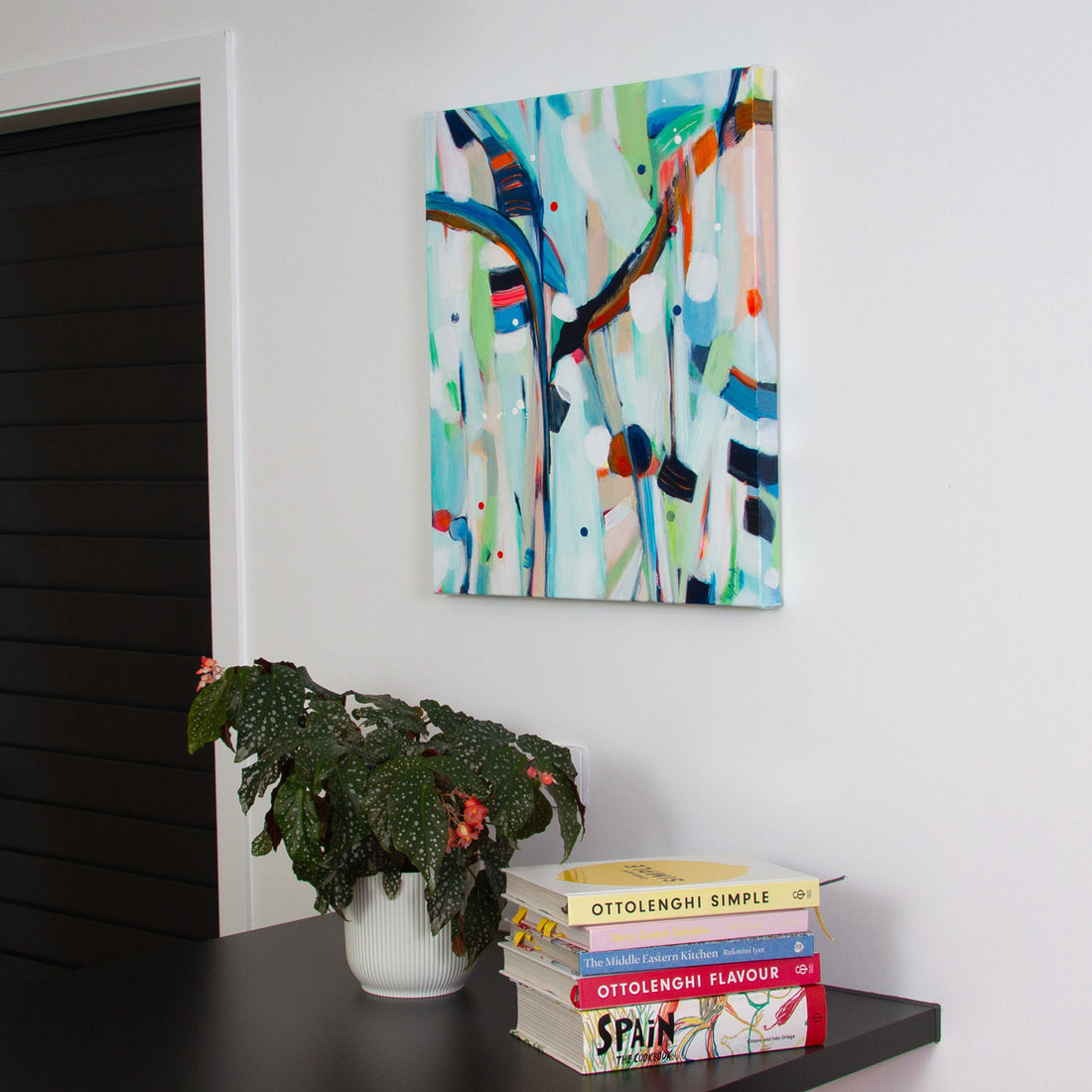 Abstract painting Caterpillar Snack Bar hanging on a kitchen wall