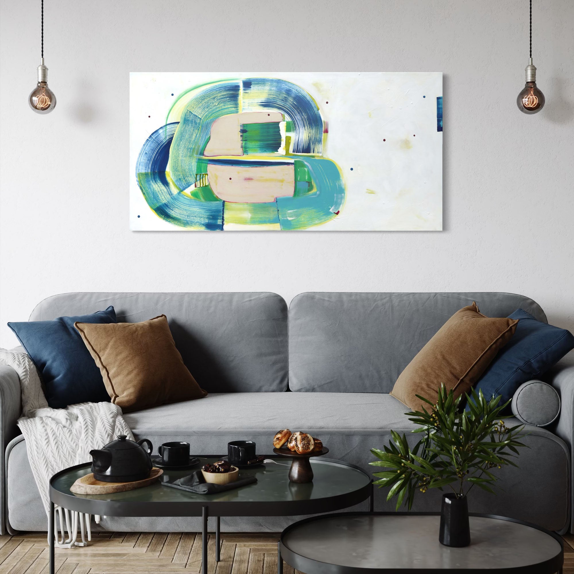 Gerbil Pirouette abstract painting by Kirsty Black hung horizontally on white wall above modern grey sofa with navy and tan cushions