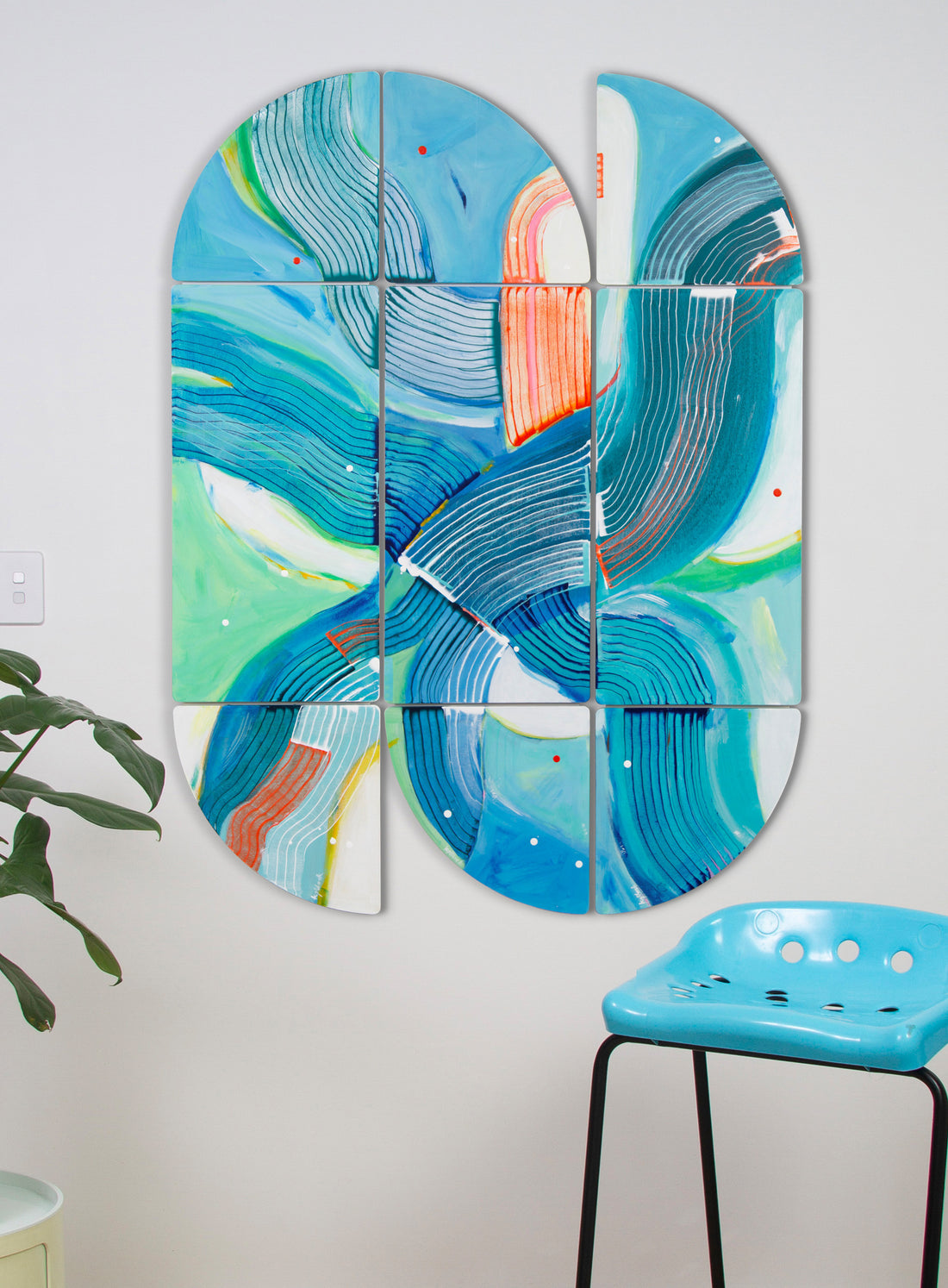 Duck Derby, rhythmic triptych abstract painting with blue, green, orange hanging on white wall