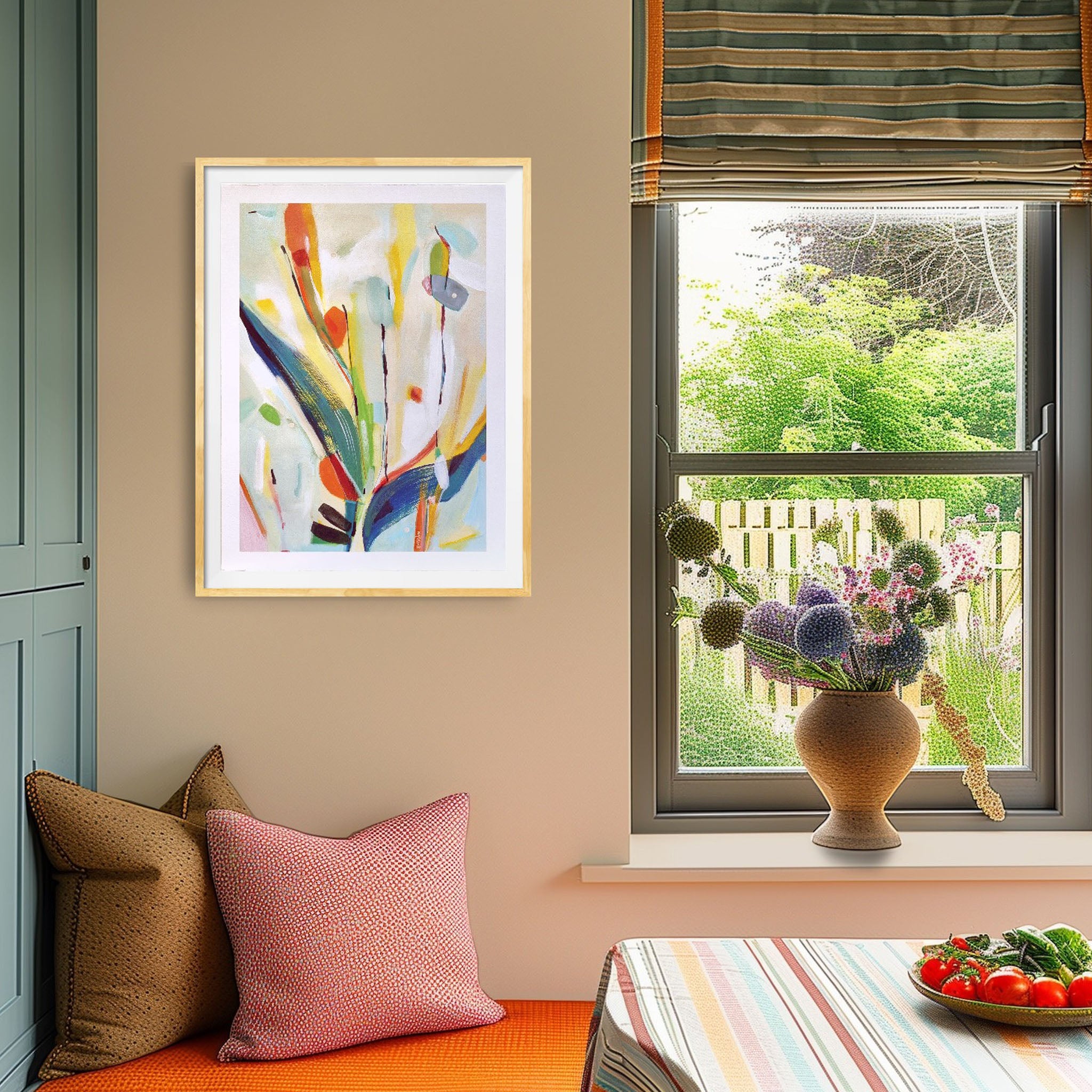 Restful abstract paintings hanging in a colourful home