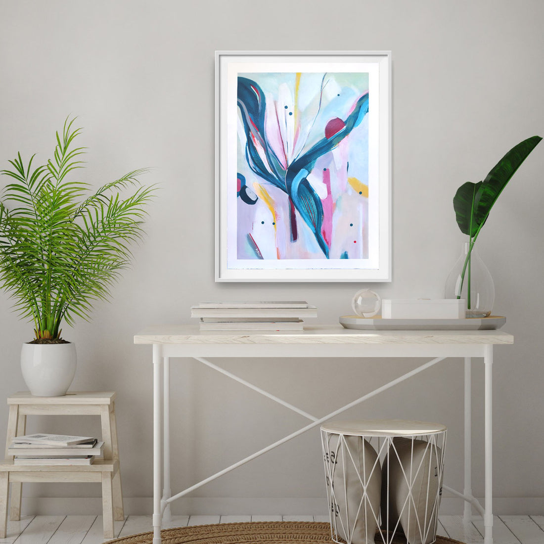 Abstract artwork, Mother of the Pony Club Bride in a white frame on a wall above a desk with plants