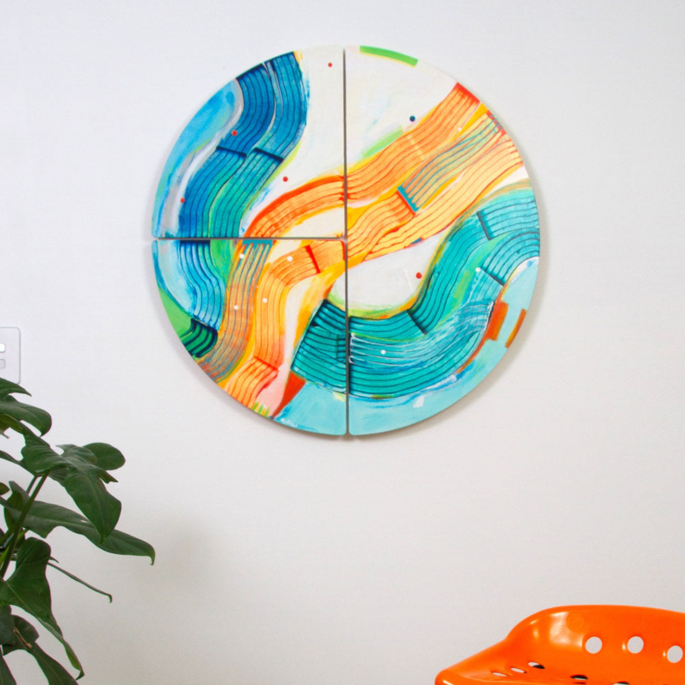 Pedalo Patsy - round abstract artwork in vibrant colours hanging on a white wall