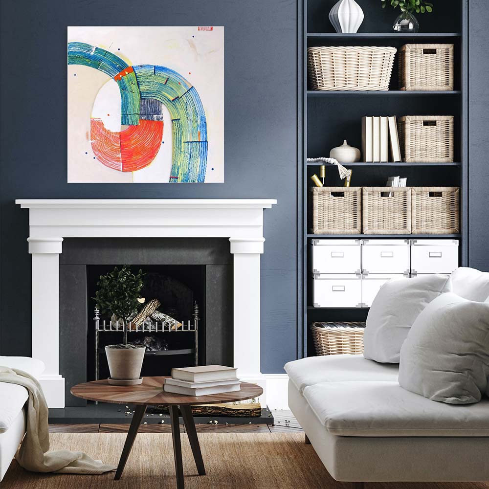 Sandhopper Springboard abstract painting by Kirsty Black above white fireplace mantel on dark blue wall in classic living room with white sofa and wicker baskets