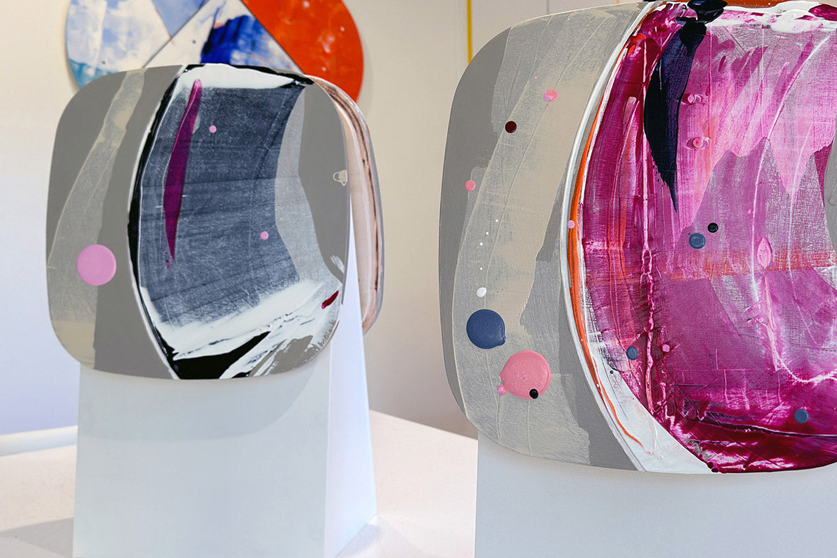 Lilo Blue shaped abstract artworks by Kirsty Black, featuring layered pink, grey, black and white paintings displayed on plinths