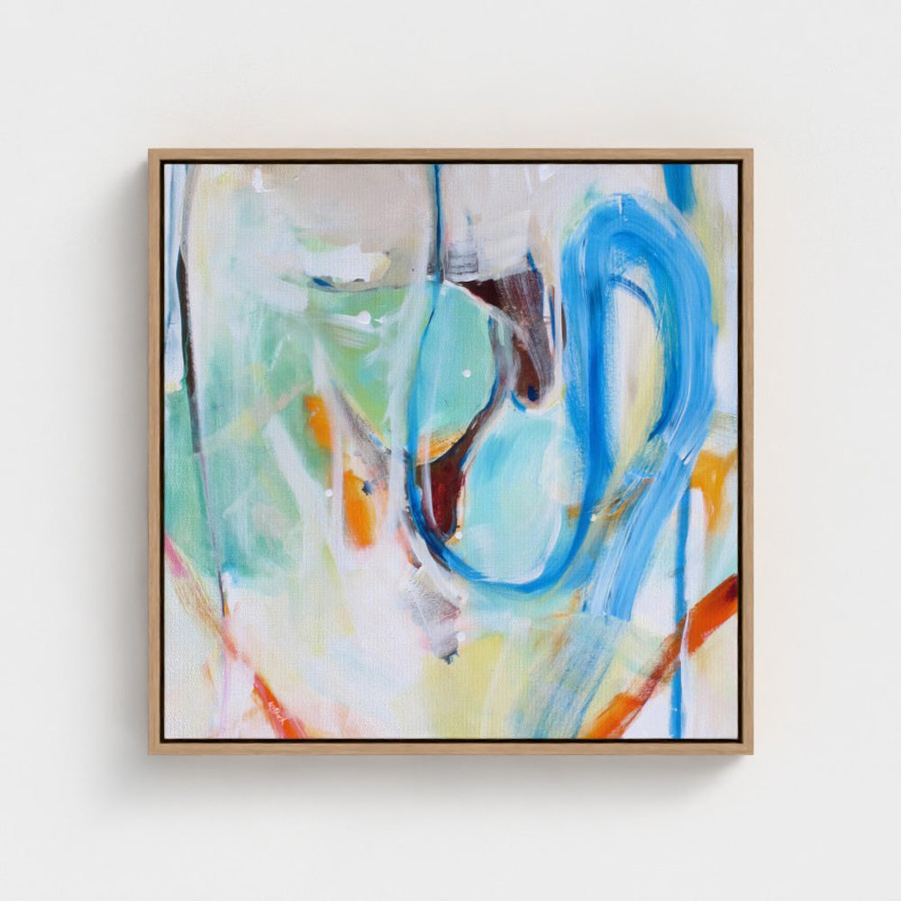 An abstract canvas art print titled Haywire by Kirsty Black, shown from a front-facing perspective inside a thin natural oak floating frame. The artwork features a large, expressive loop of blue paint on a soft mint green and cream backdrop, highlighted by sharp strokes of rust orange and deep burgundy.