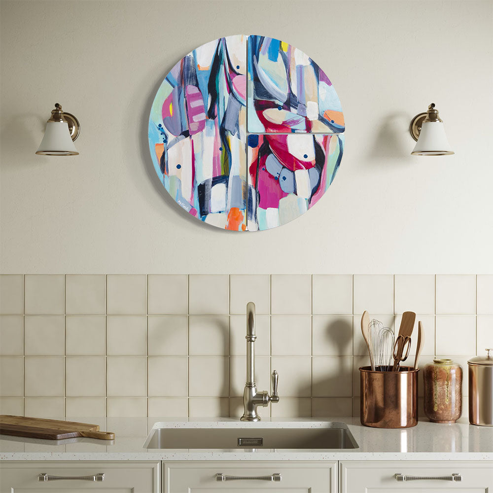 Damselfly Shimmy circular wall sculpture by Kirsty Black mounted above kitchen sink in classic cream kitchen with subway tiles, brass wall sconces and copper utensil holders