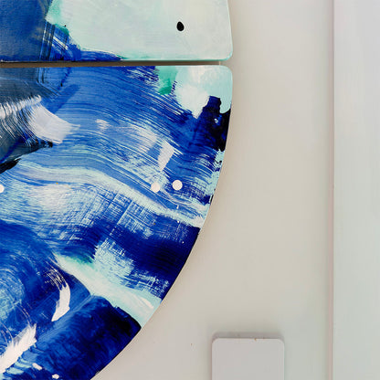 Close-up detail of Anemone Guise wall sculpture by Kirsty Black showing layered cobalt and navy blue brushstrokes with white and teal accents on bevelled plywood tiles mounted on white wall